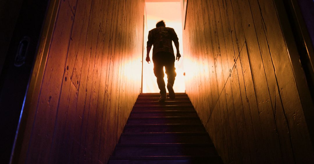 The Redeemer — silhouette on staircase